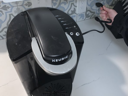 Unplug the Keurig Coffee Pot